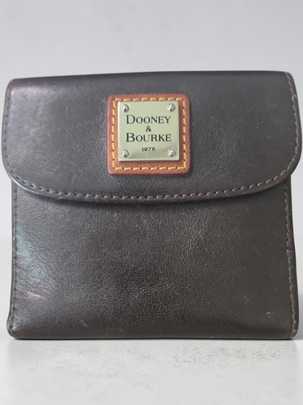 Dooney & Bourke Brown Leather Trifold Wallet with Brass Logo Plaque